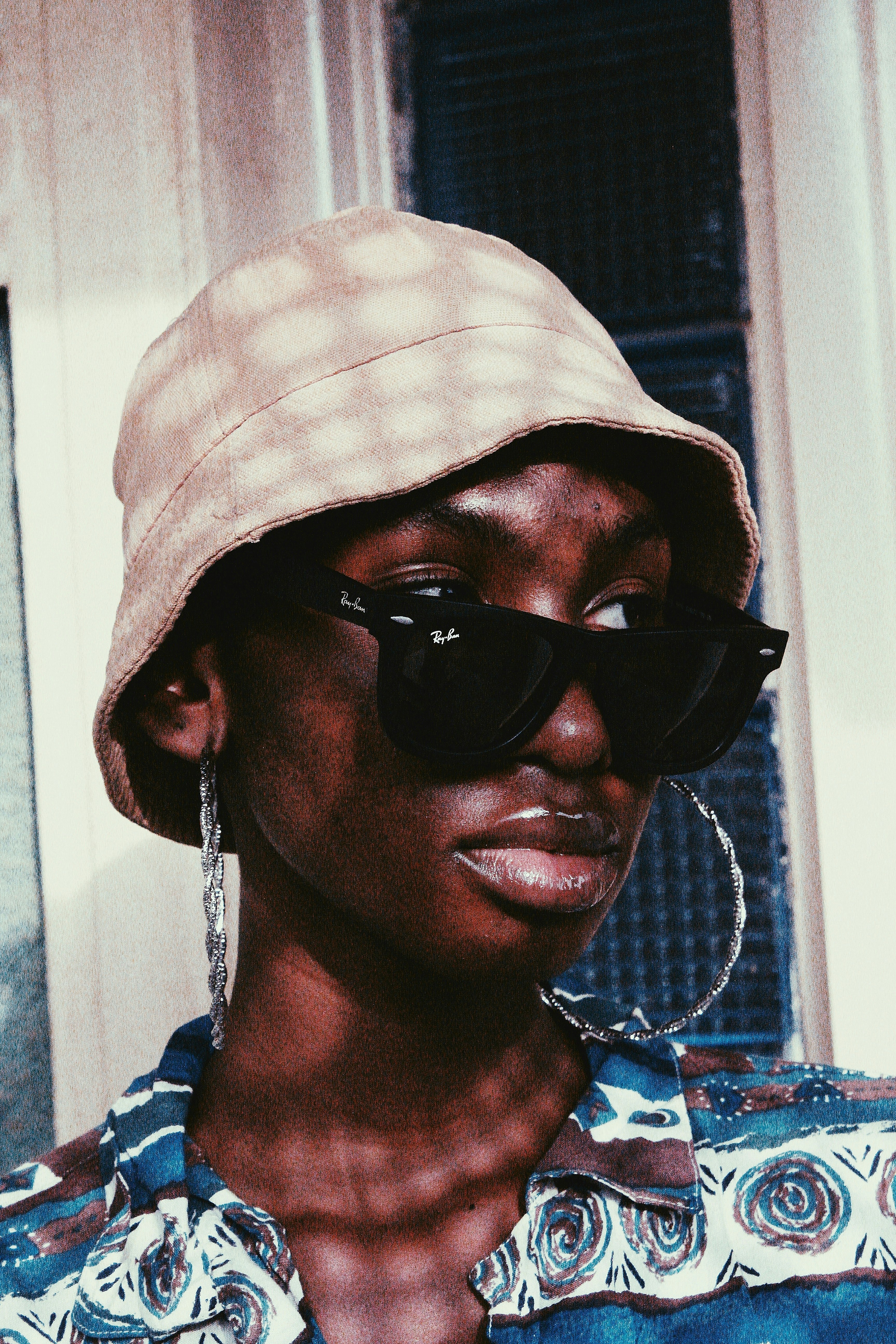 woman wearing black sunglasses and white hat